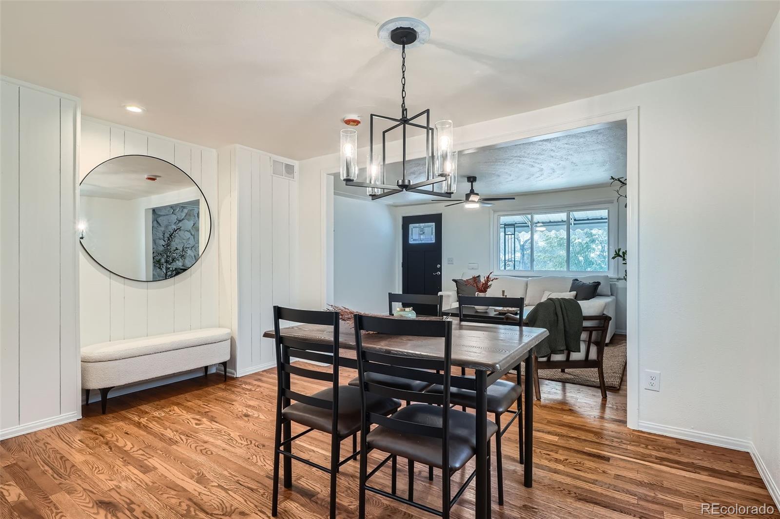 1720 South Java Way Denver, CO 80219 - Photo 5 of 28 a view of a dining room with furniture window and wooden floor