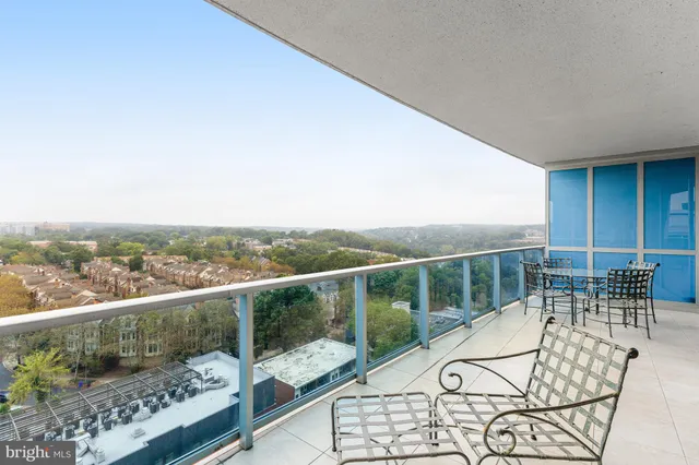 a view of a balcony with lake view and a floor to ceiling window