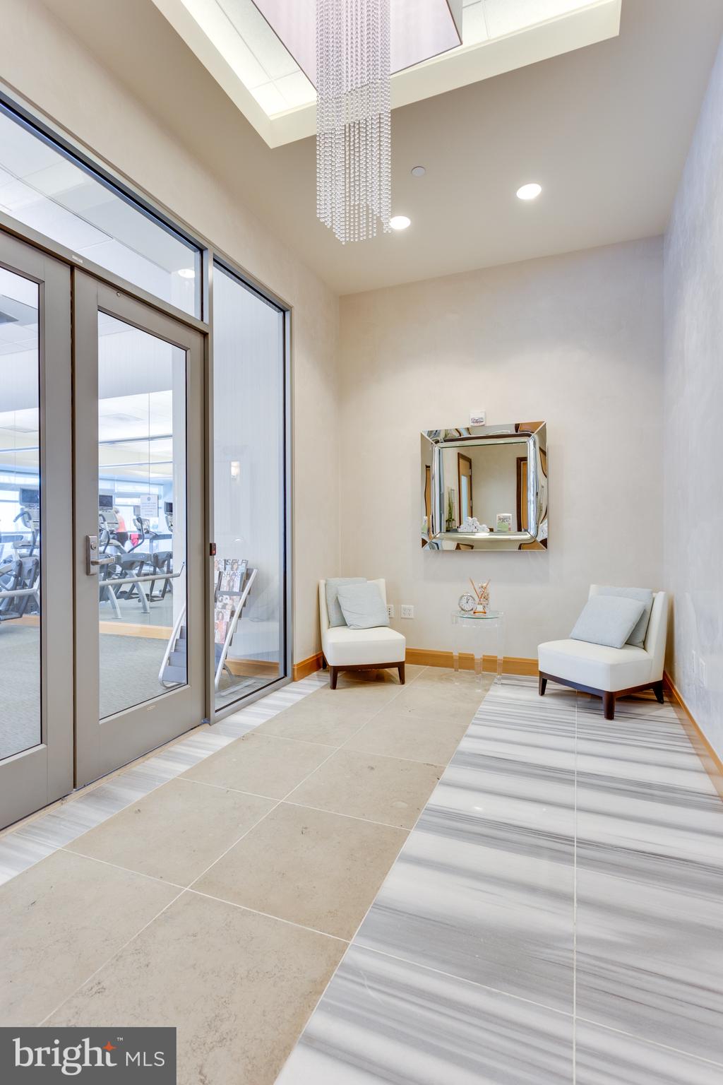 1881 North Nash Street, Unit 1706 Arlington, VA 22209 - Photo 26 of 50 a bedroom with furniture and a mirror
