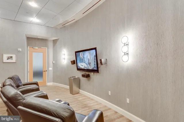 a bedroom with furniture and a wooden floor