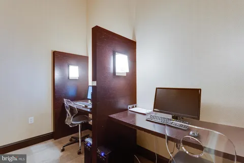 a view of a workspace with furniture