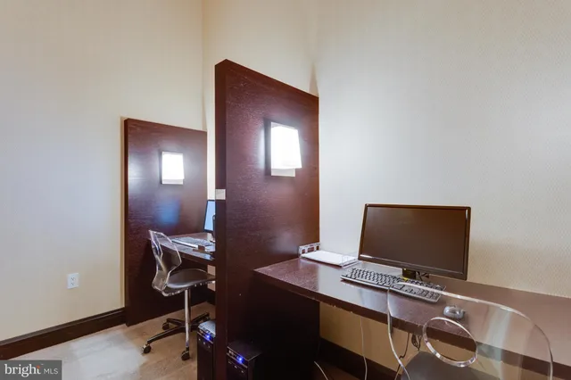 a view of a workspace with furniture