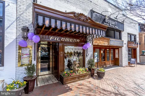a view of a building with sitting area