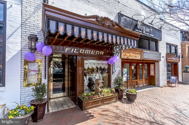 a view of a building with sitting area