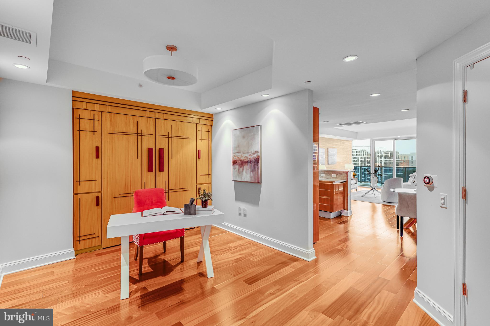 1881 North Nash Street, Unit 1706 Arlington, VA 22209 - Photo 4 of 50 a living room with furniture and a large window