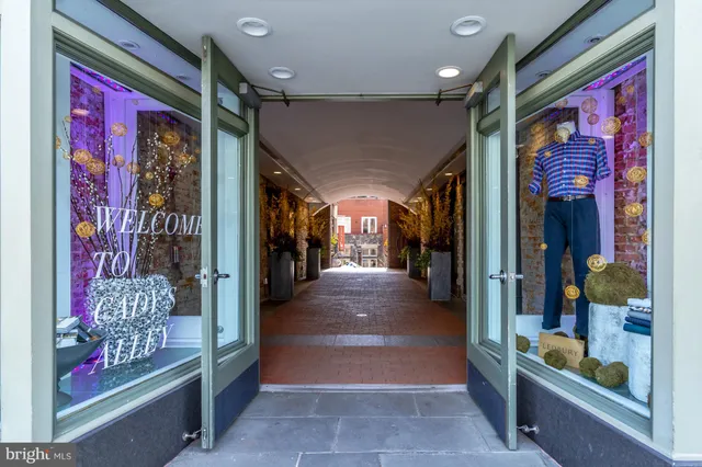 a view of a entryway door with a hallway