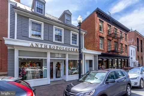 a front view of a building with outdoor space