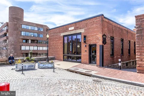 a front view of a building with seating space