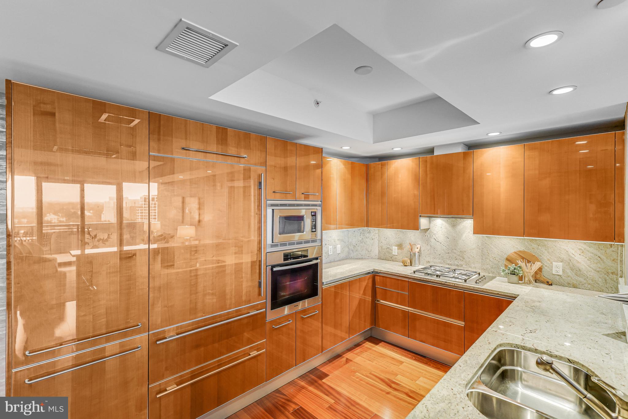 1881 North Nash Street, Unit 1706 Arlington, VA 22209 - Photo 8 of 50 a kitchen with stainless steel appliances granite countertop a sink and cabinets