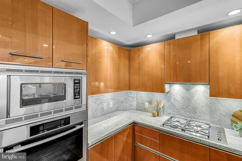 a kitchen with a stove a sink and a microwave