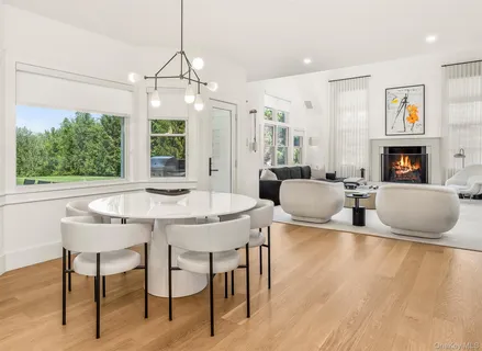 a view of a dining room with furniture window and outside view
