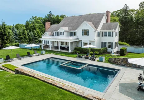 a view of a backyard with a garden and trees
