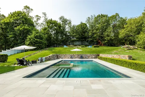 a front view of a house with swimming pool