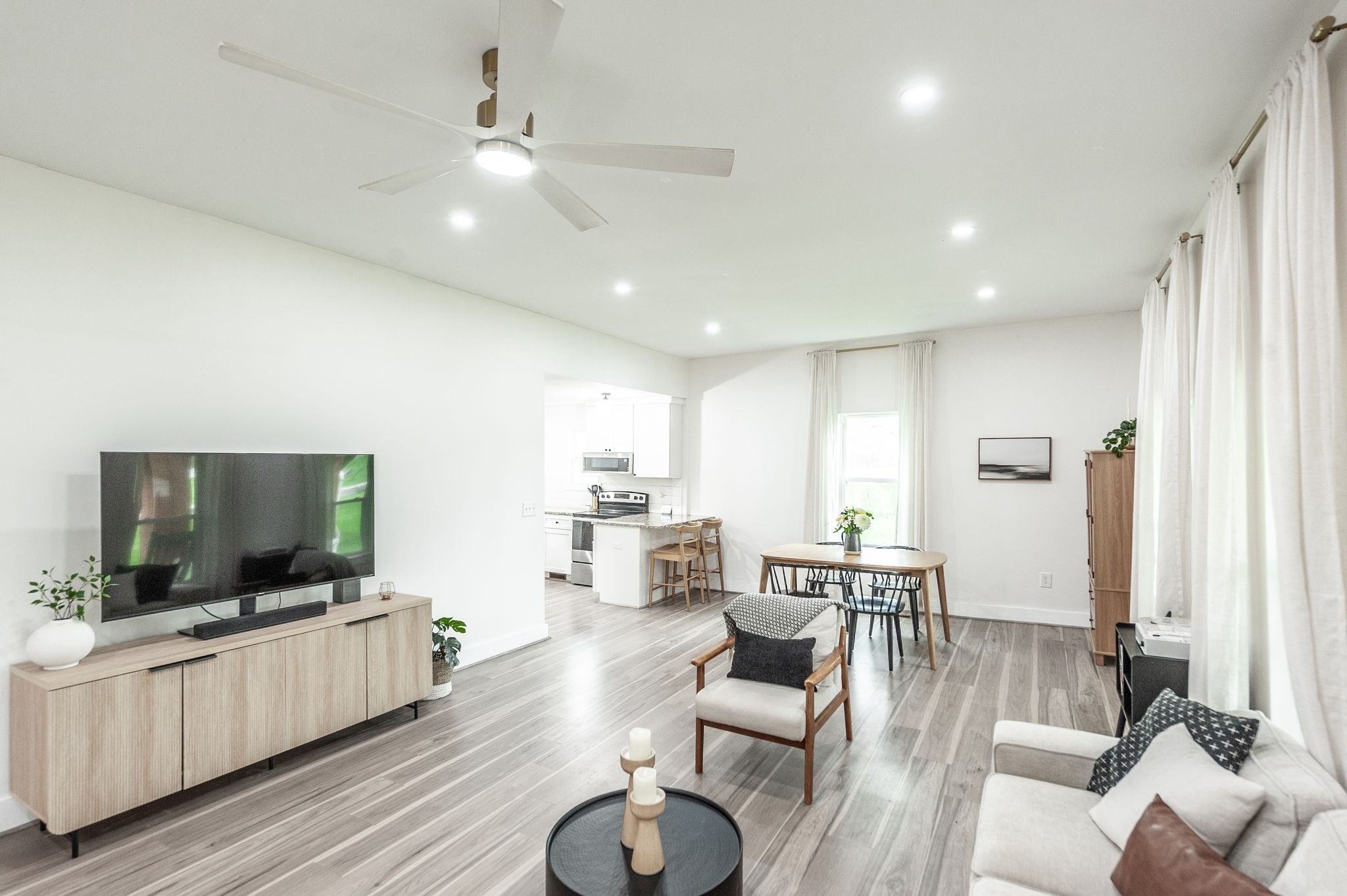 375 Mt Vernon Road Bethpage, TN 37022 - Photo 17 of 66 a living room with furniture a flat screen tv and kitchen view
