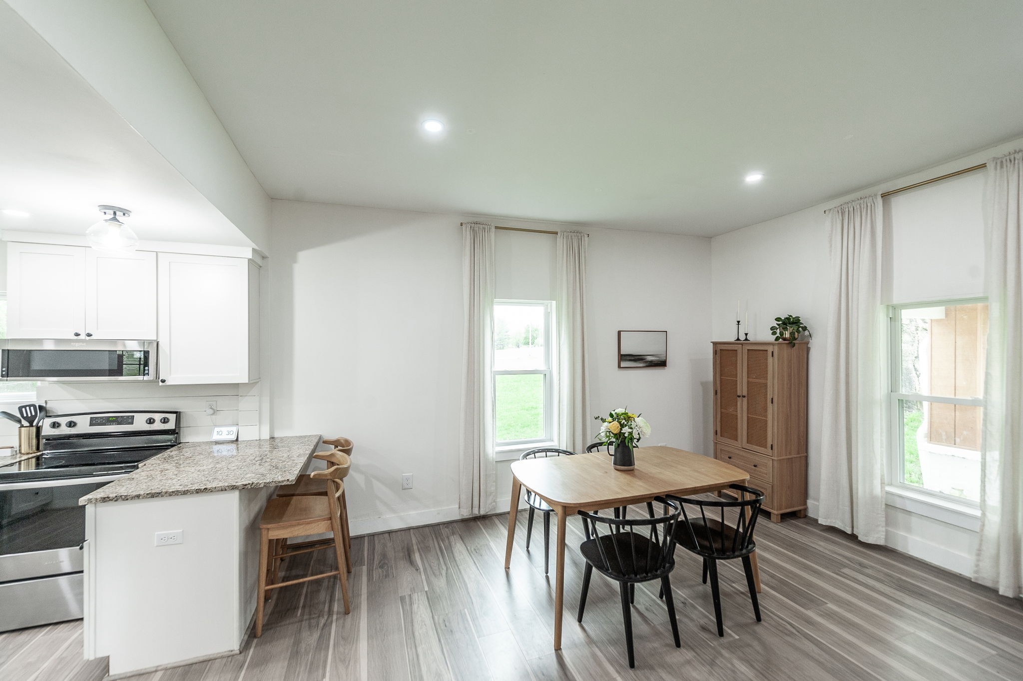 375 Mt Vernon Road Bethpage, TN 37022 - Photo 18 of 66 a view of a dining room with furniture and wooden floor