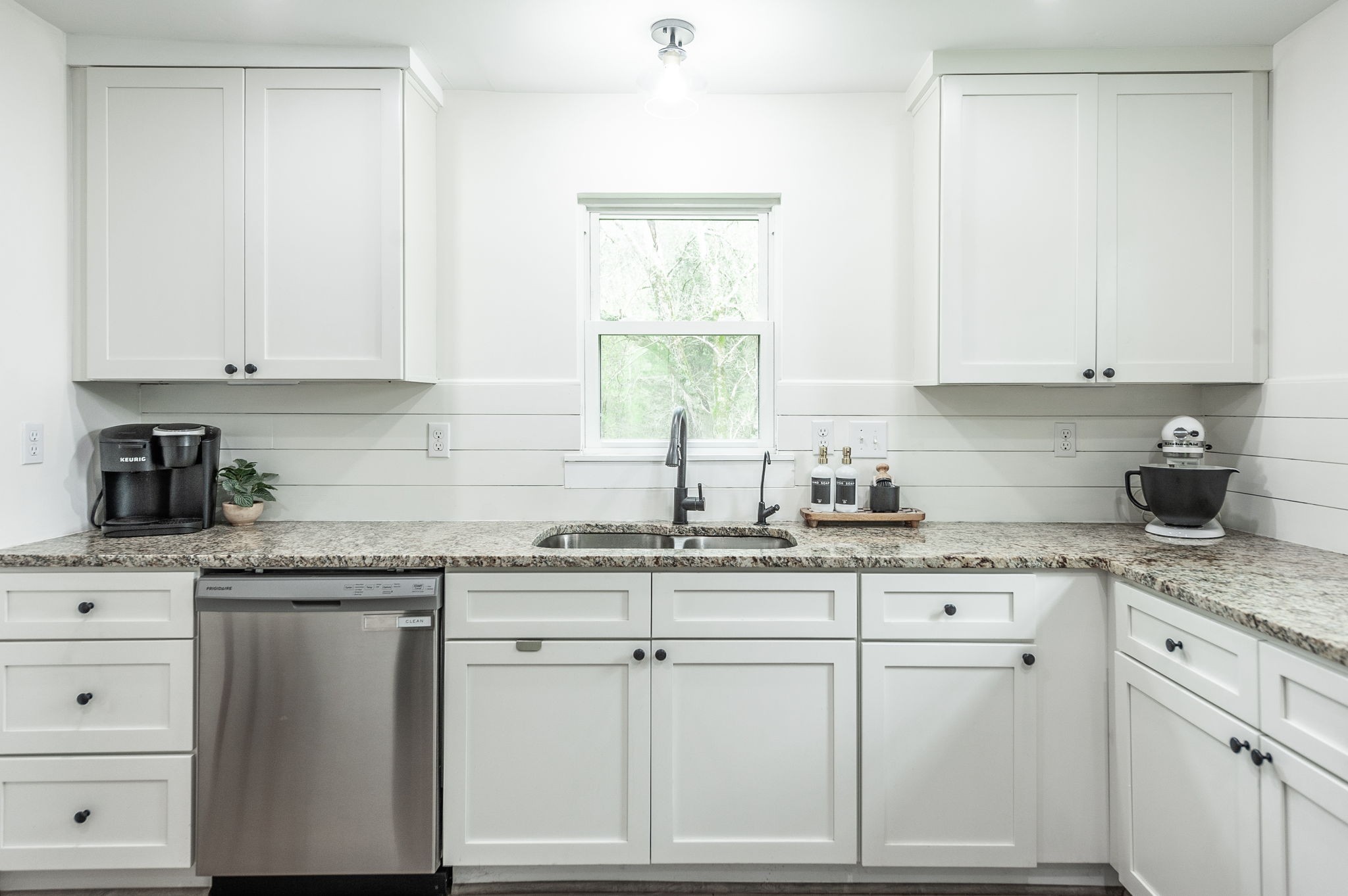 375 Mt Vernon Road Bethpage, TN 37022 - Photo 20 of 66 a kitchen with granite countertop white cabinets and white appliances