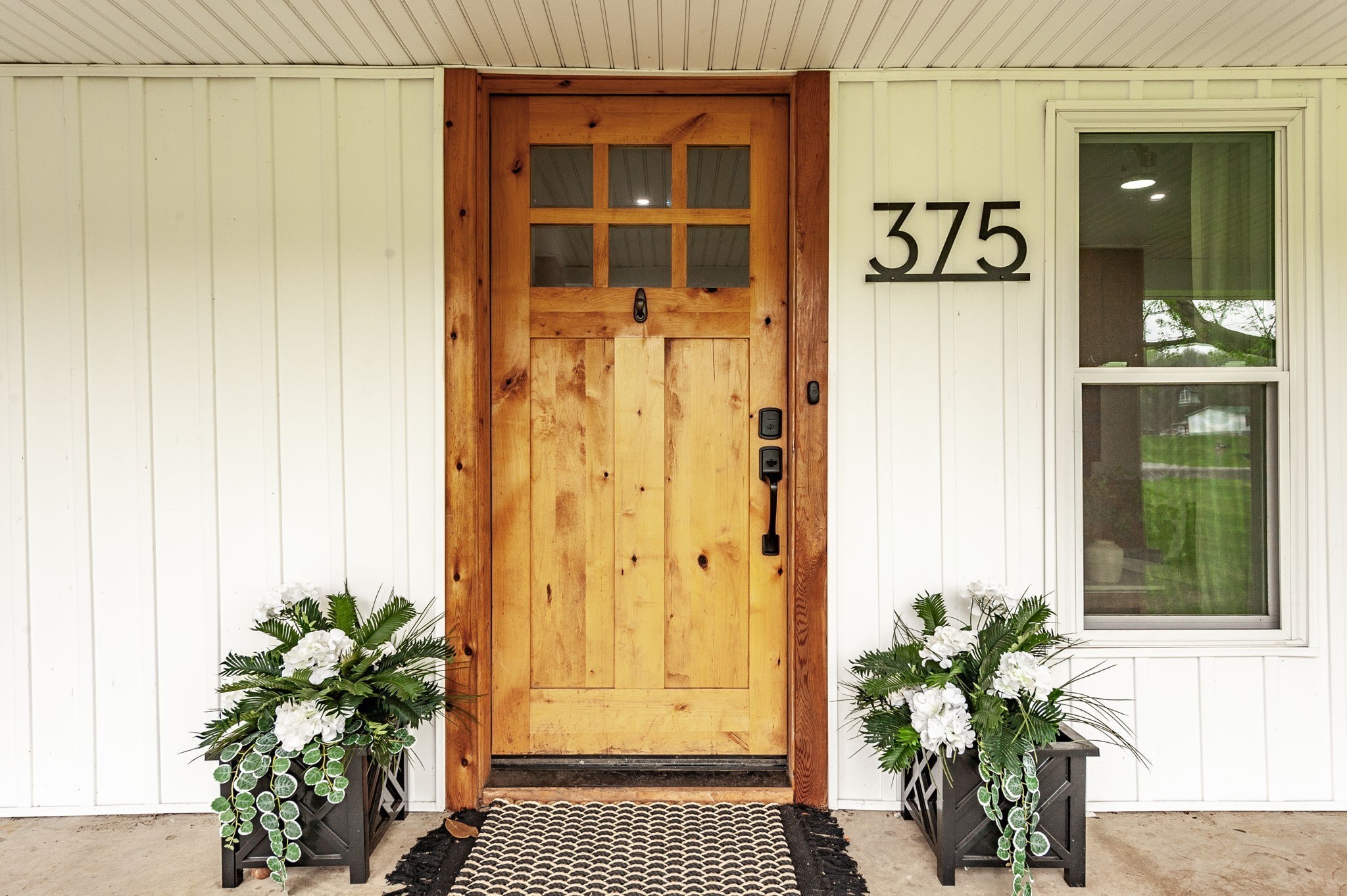 375 Mt Vernon Road Bethpage, TN 37022 - Photo 2 of 66 a potted plant sitting in front of a door