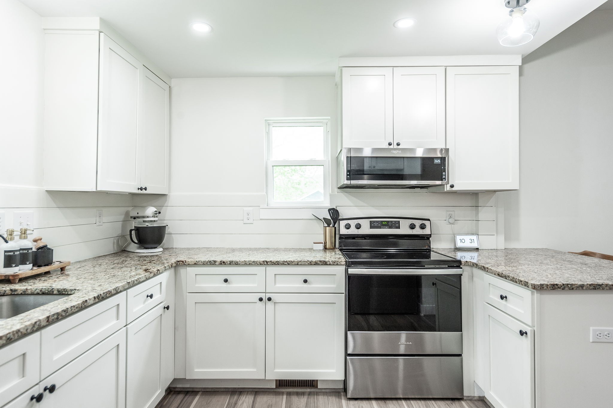 375 Mt Vernon Road Bethpage, TN 37022 - Photo 23 of 66 a kitchen with granite countertop white cabinets and appliances
