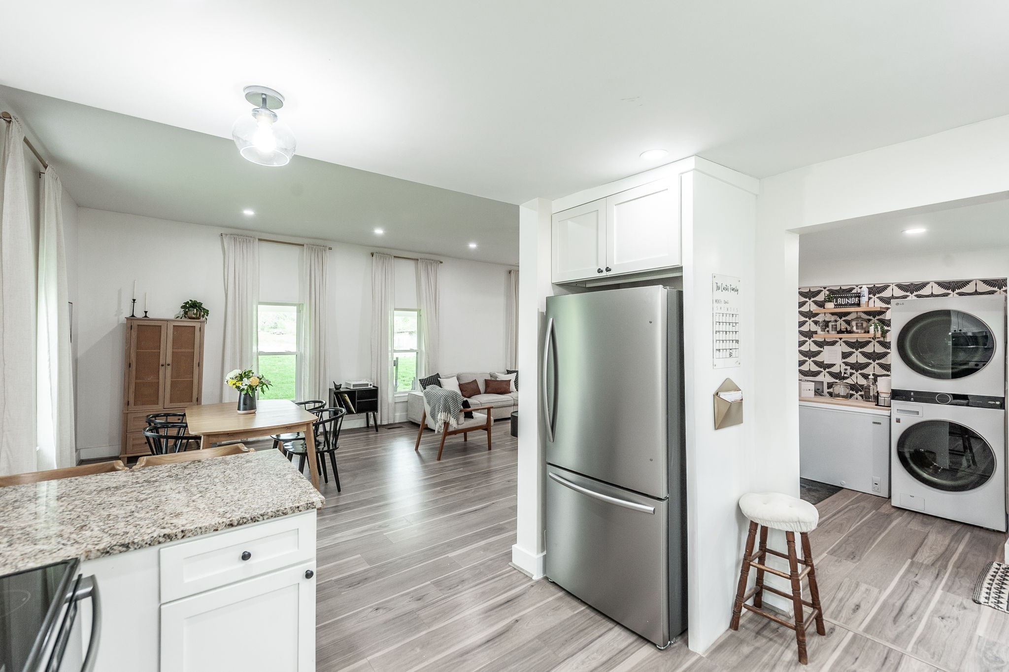 375 Mt Vernon Road Bethpage, TN 37022 - Photo 24 of 66 a kitchen with a refrigerator a stove top oven a counter space and living room view