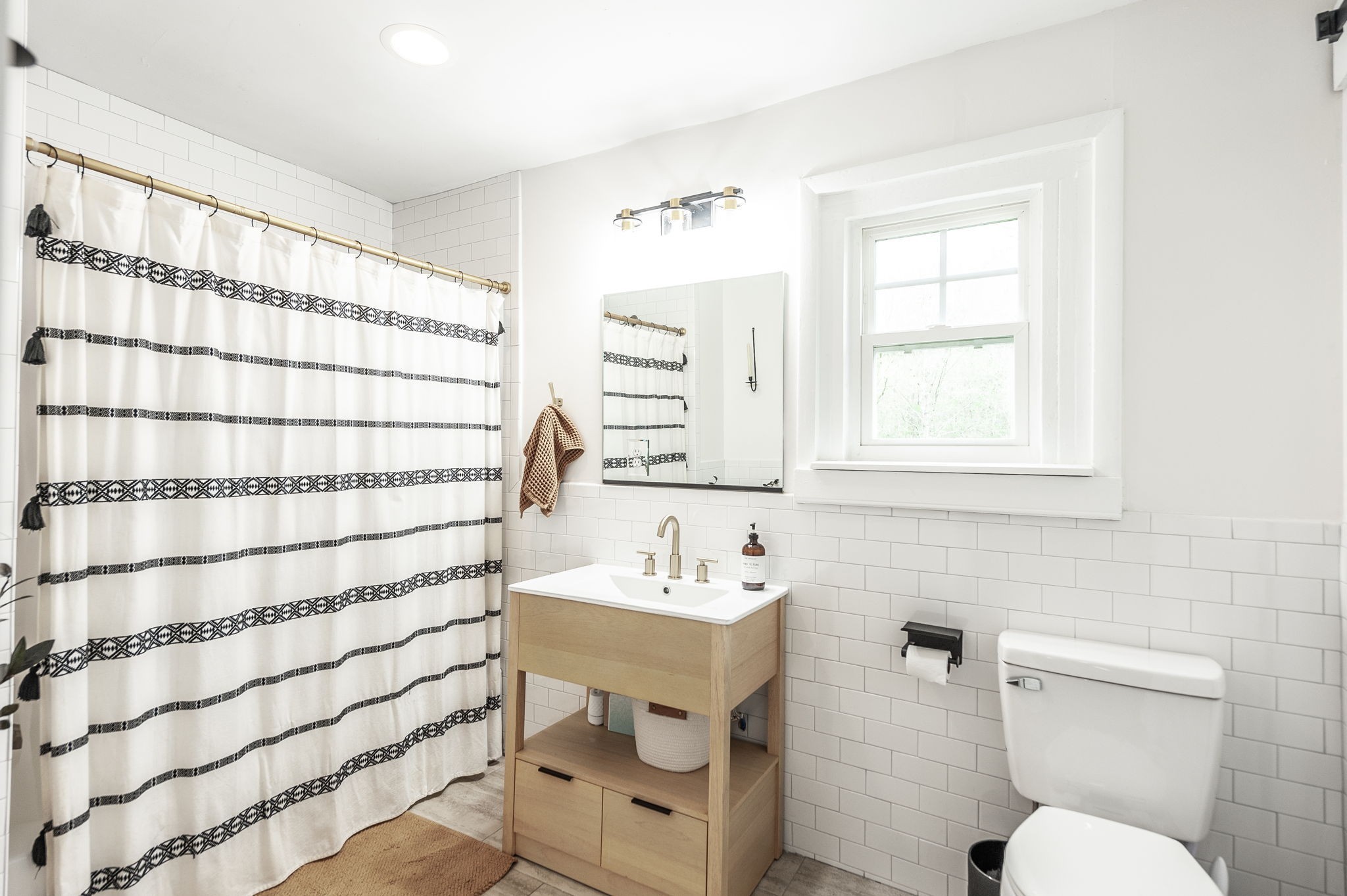 375 Mt Vernon Road Bethpage, TN 37022 - Photo 31 of 66 a bathroom with a sink toilet a mirror and shower