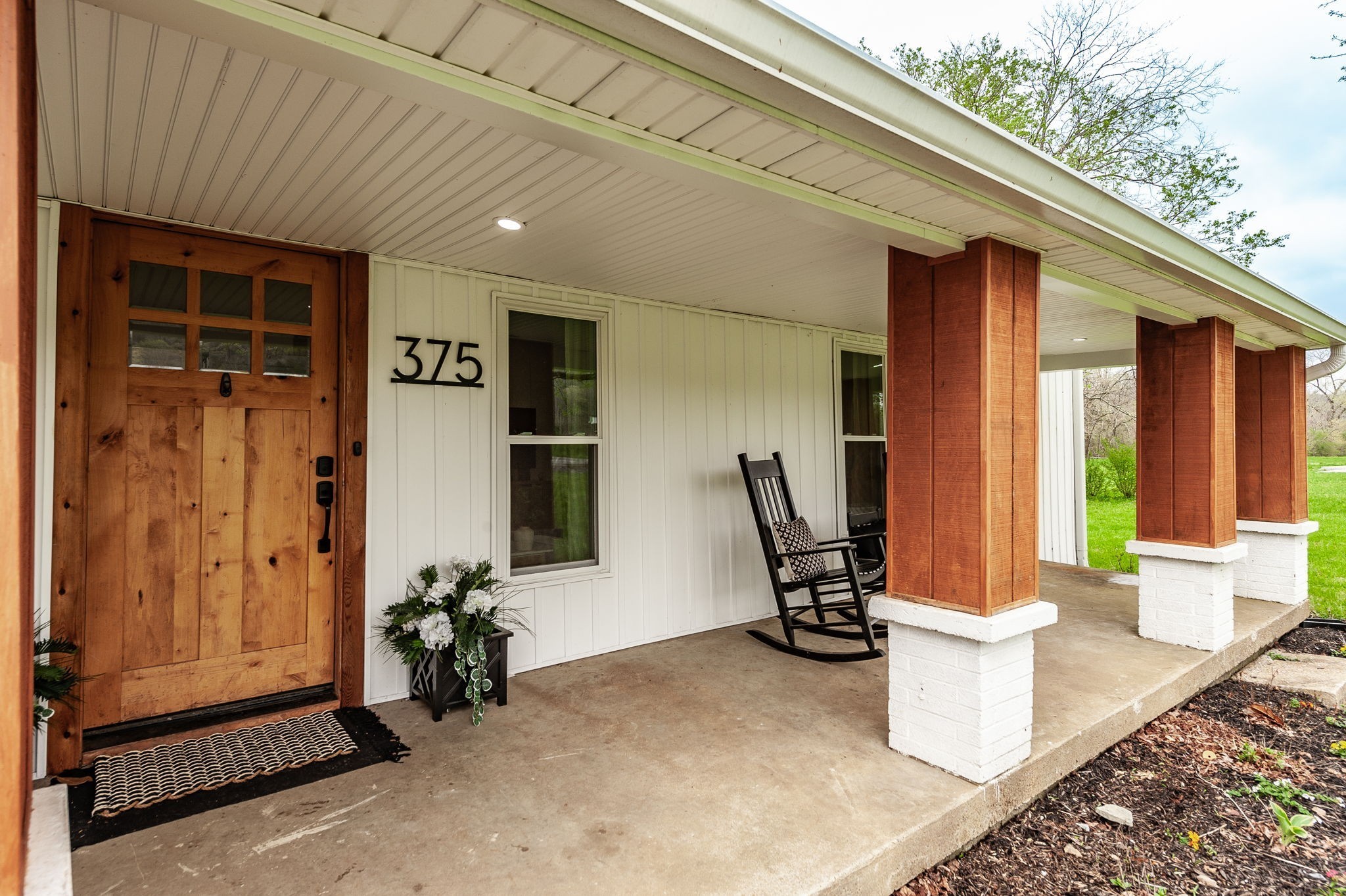 375 Mt Vernon Road Bethpage, TN 37022 - Photo 5 of 66 a view of a patio with table and chairs and potted plants