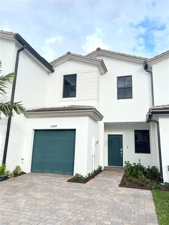 a front view of a house with a garage