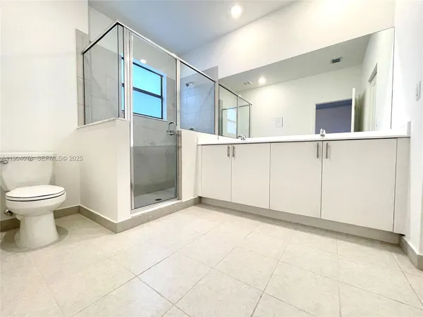 a kitchen with stainless steel appliances a refrigerator sink and microwave