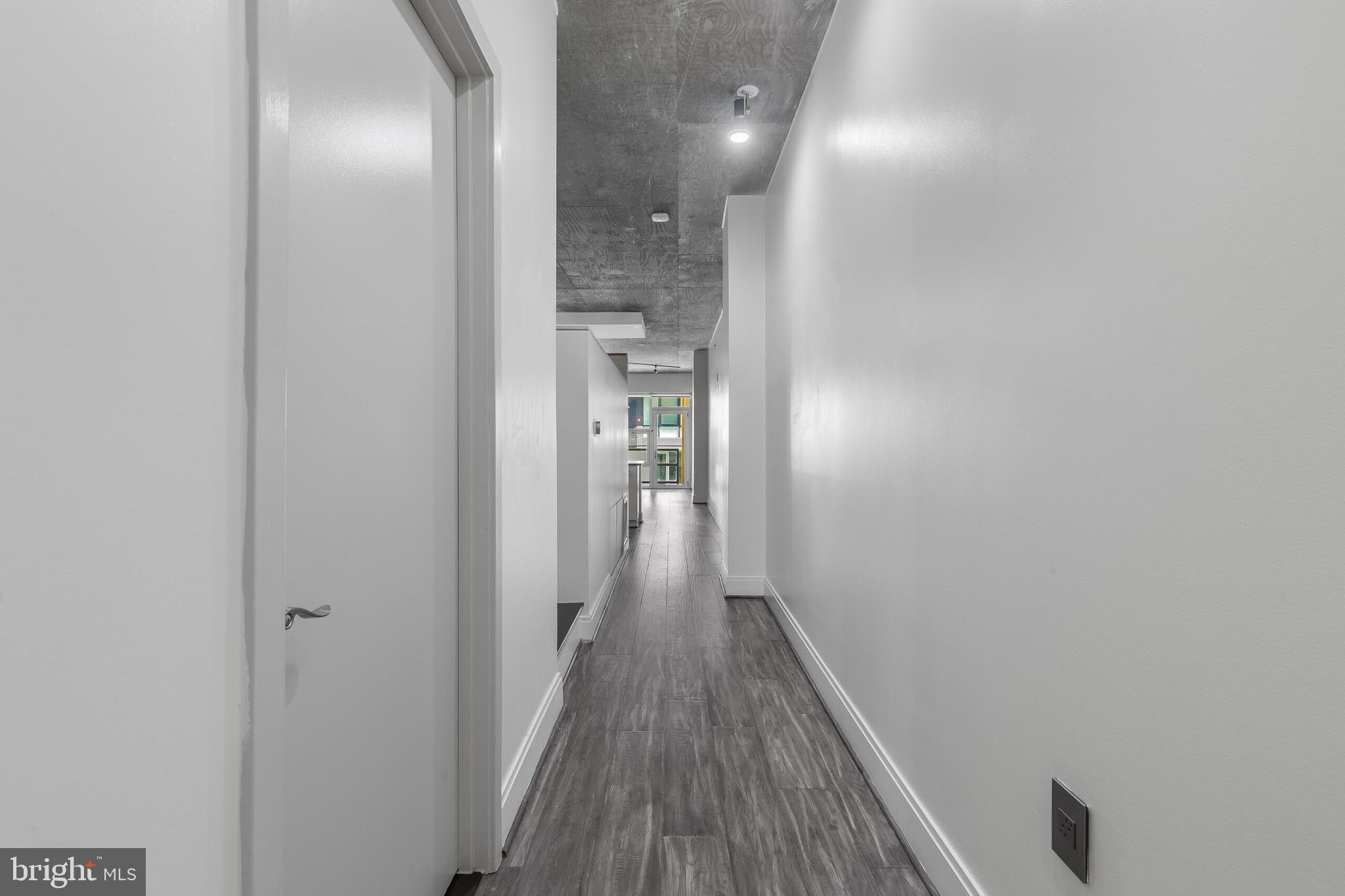 929 Florida Avenue Northwest, Unit 2001 Washington, DC 20001 - Photo 22 of 42 a view of hallway with wooden floor