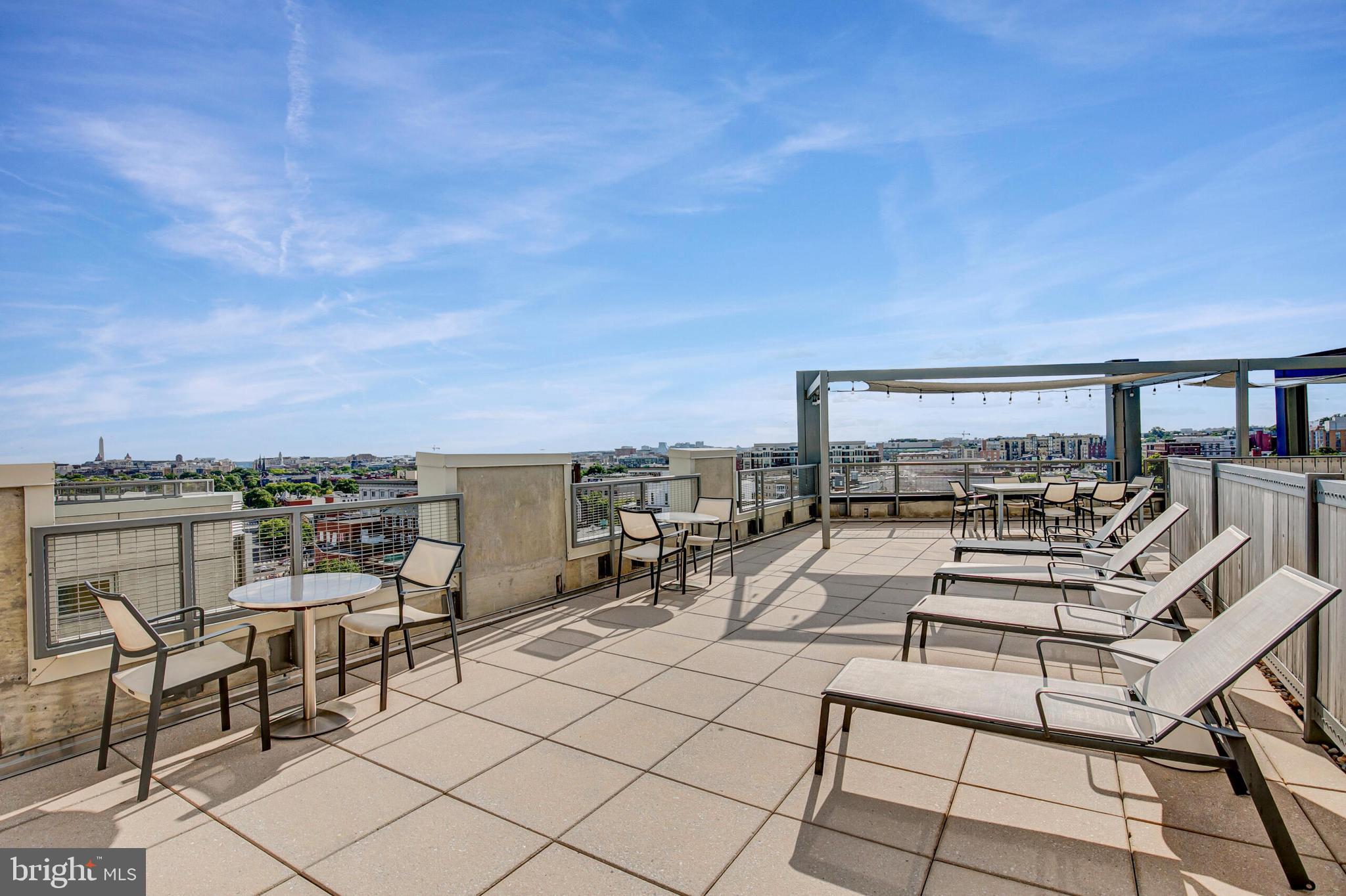 929 Florida Avenue Northwest, Unit 2001 Washington, DC 20001 - Photo 31 of 42 a view of a terrace with furniture and a view of the ocean