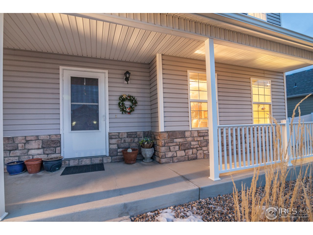 6948 McClellan Road Wellington, CO 80549 - Photo 4 of 36 and a covered front porch!