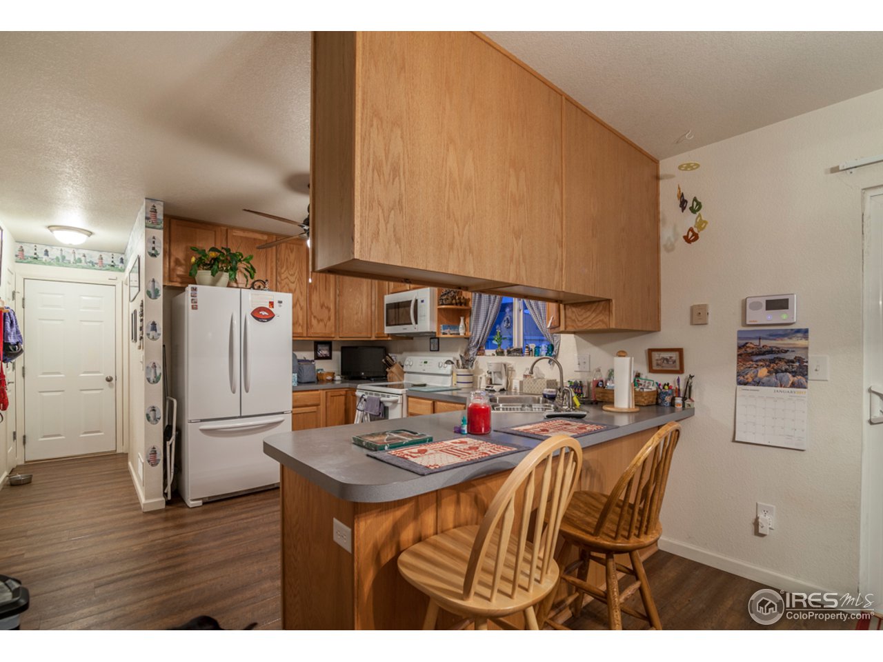 6948 McClellan Road Wellington, CO 80549 - Photo 7 of 36 and built in breakfast counter