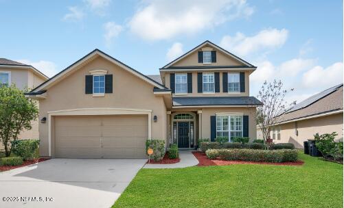 11156 Limerick Drive Jacksonville, FL 32221 - Photo 1 of 49 a front view of a house with a yard and garage