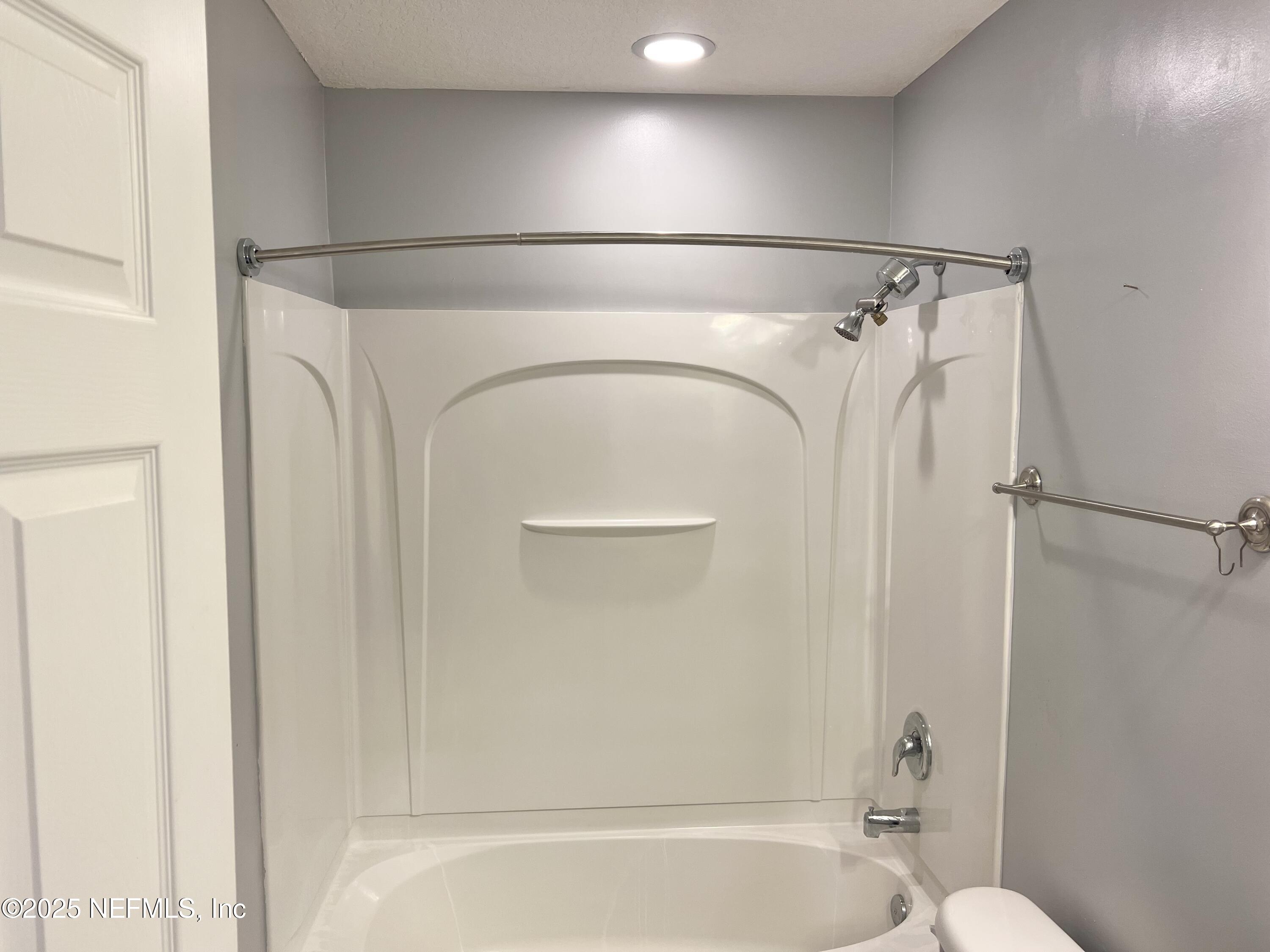 11156 Limerick Drive Jacksonville, FL 32221 - Photo 33 of 49 a bathroom with a shower and a tub