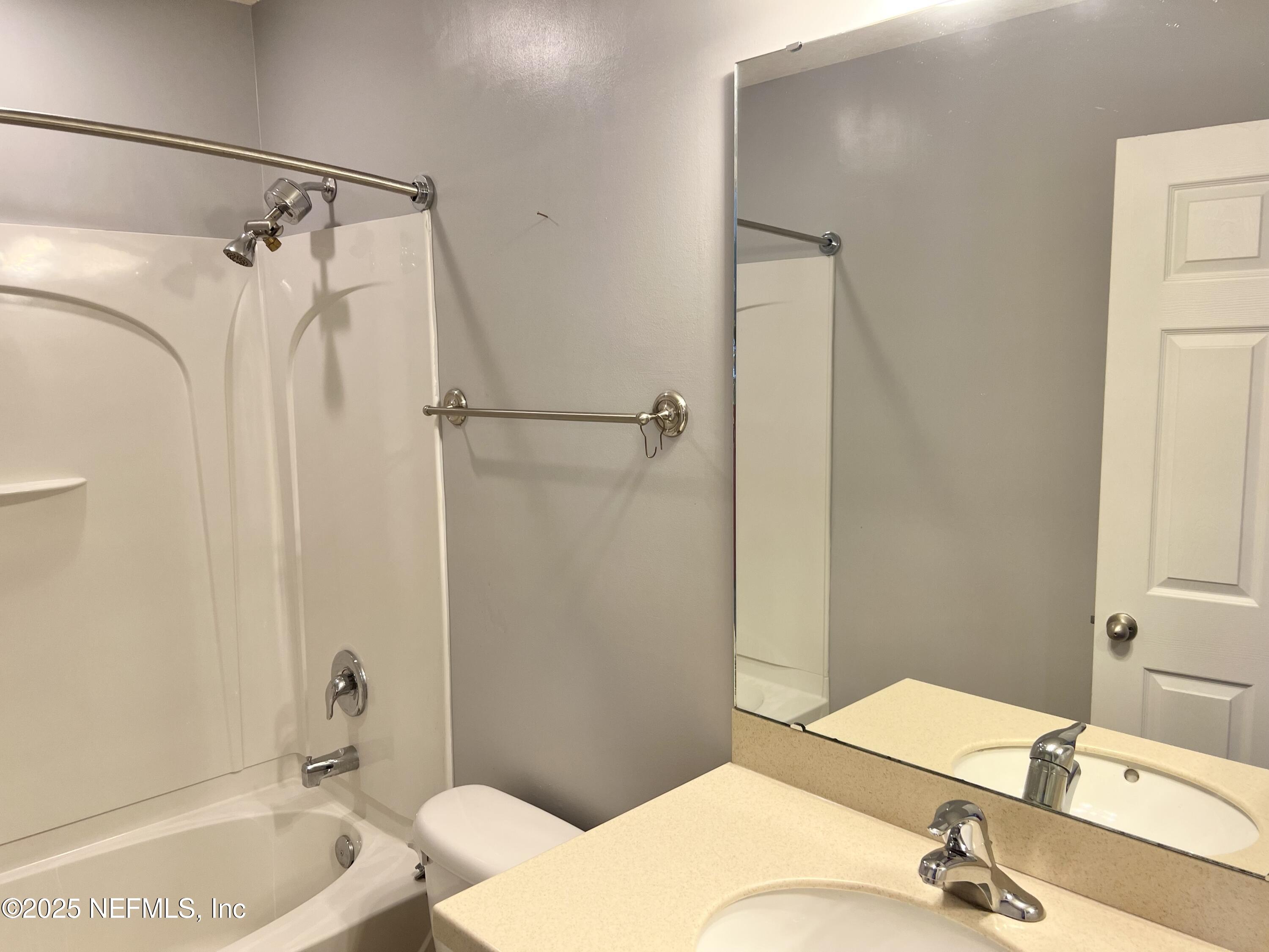 11156 Limerick Drive Jacksonville, FL 32221 - Photo 34 of 49 a bathroom with a granite countertop sink toilet and shower