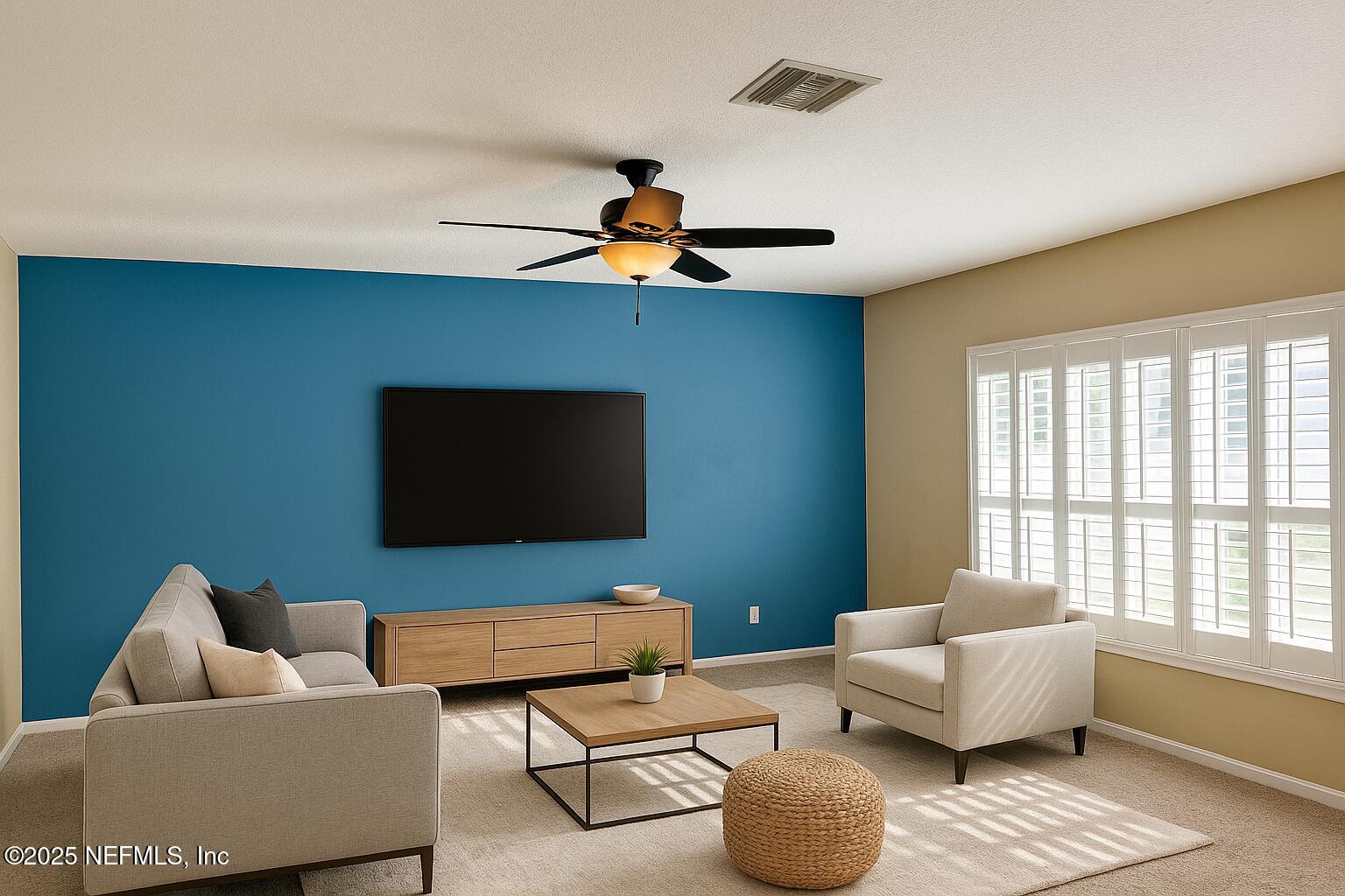 11156 Limerick Drive Jacksonville, FL 32221 - Photo 7 of 49 a living room with furniture and a flat screen tv