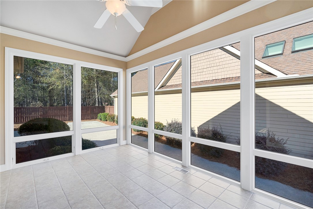 16 Oleander Drive Anderson, SC 29621 - Photo 19 of 37 A spacious sunroom with vaulted ceilings and abundant natural light from numerous windows and skylights.