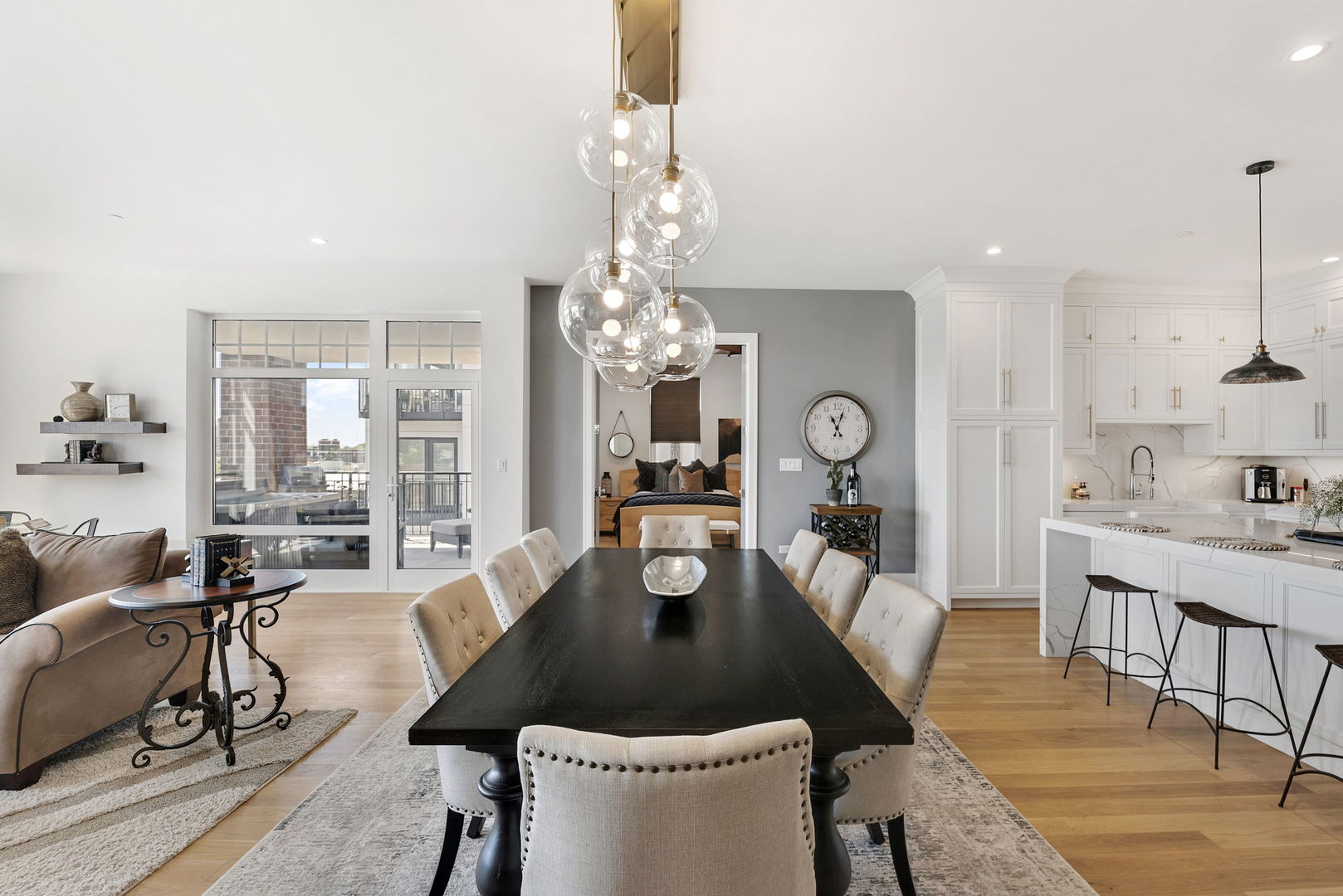 195 North Addison Avenue, Unit 303 Elmhurst, IL 60126 - Photo 11 of 30 a living room with furniture a chandelier and a dining table