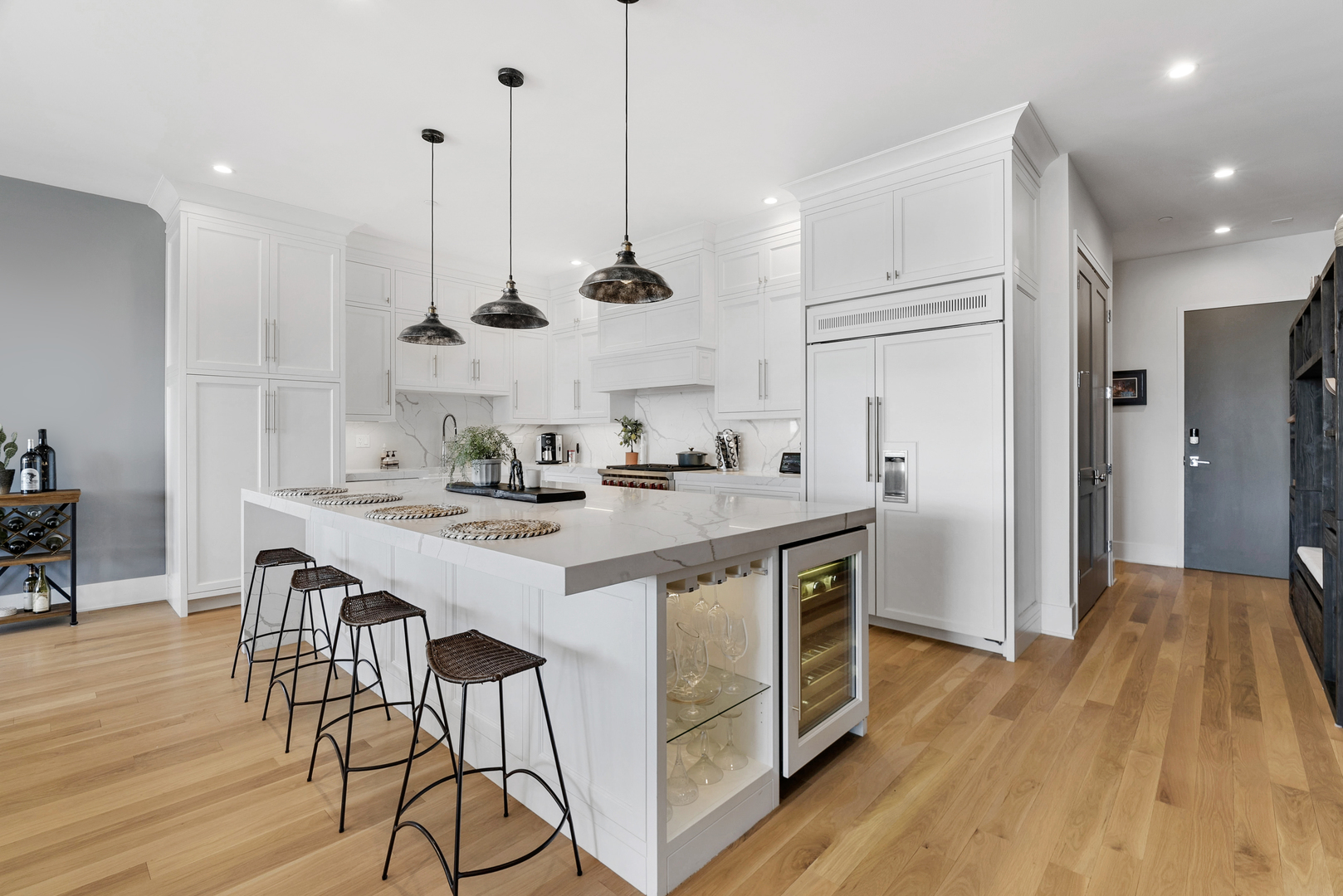 195 North Addison Avenue, Unit 303 Elmhurst, IL 60126 - Photo 10 of 30 a kitchen with kitchen island a wooden floor and white appliances