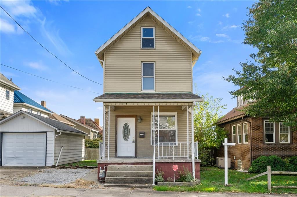 339 Brown Street Rochester, PA 15074 - Photo 1 of 17 a front view of a house with a garden