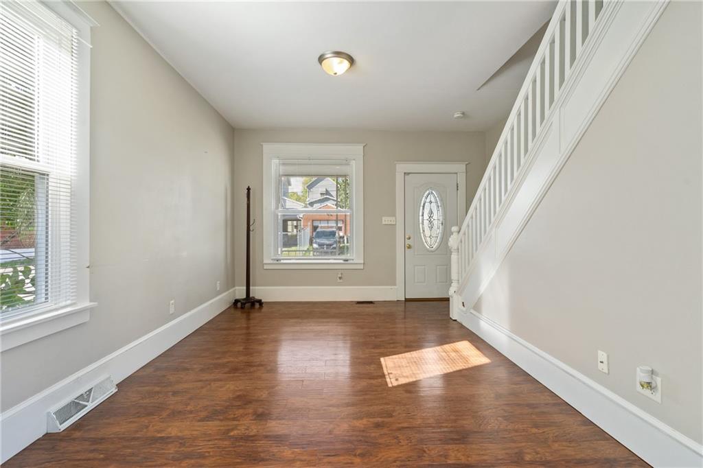 339 Brown Street Rochester, PA 15074 - Photo 4 of 17 wooden floor in an empty room with a window