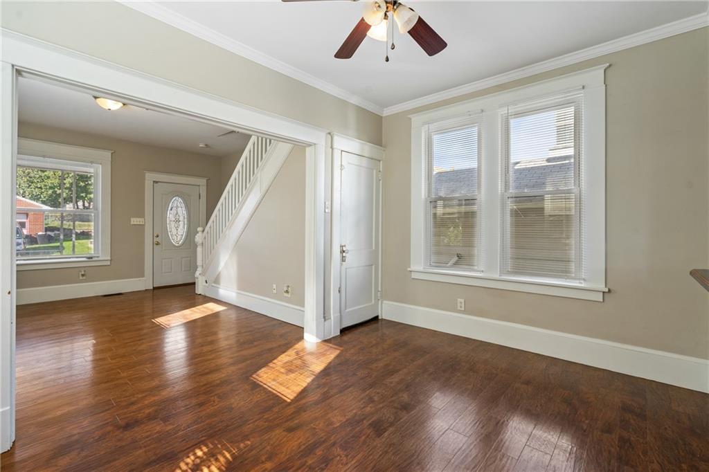 339 Brown Street Rochester, PA 15074 - Photo 6 of 17 a view of an empty room with wooden floor and a window