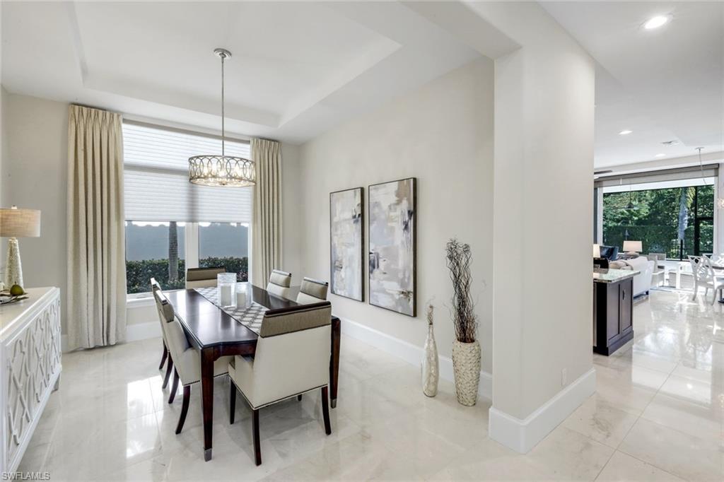 2106 Modena Court Naples, FL 34105 - Photo 10 of 42 a view of a dining room with furniture window and outside view