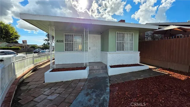 a view of a house with a large window