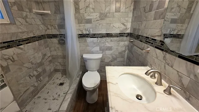 a bathroom with a sink and a toilet