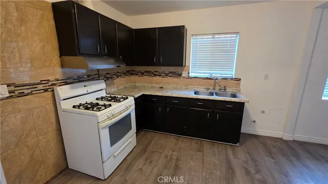 a kitchen with a sink and a stove