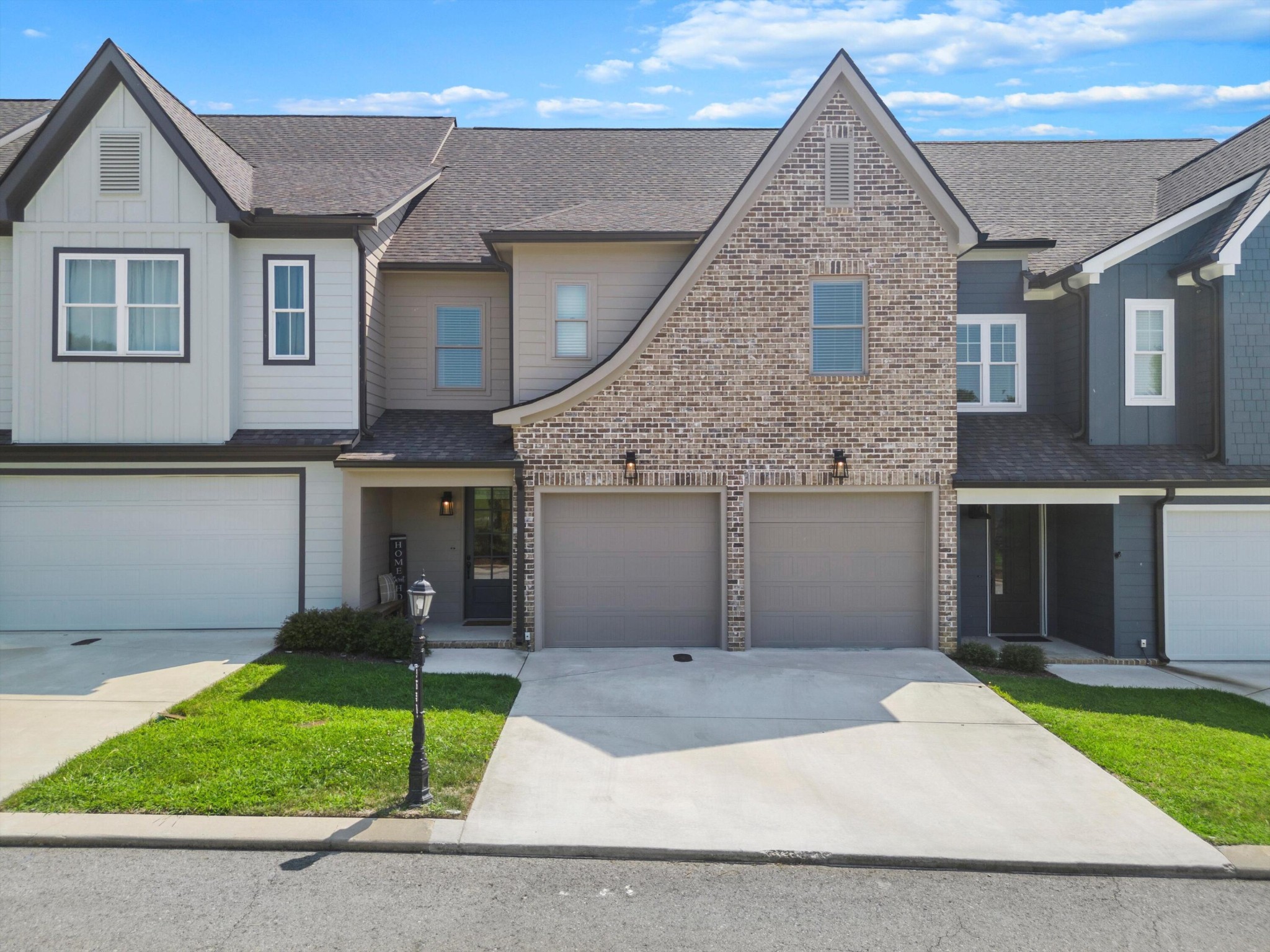 9638 Dutton Lane Ooltewah, TN 37363 - Photo 1 of 38 a front view of a house with a yard and garage