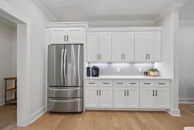 a view of a dining room with furniture and a fireplace