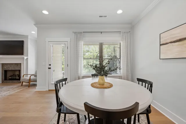 a living room with furniture potted plant and a chandelier