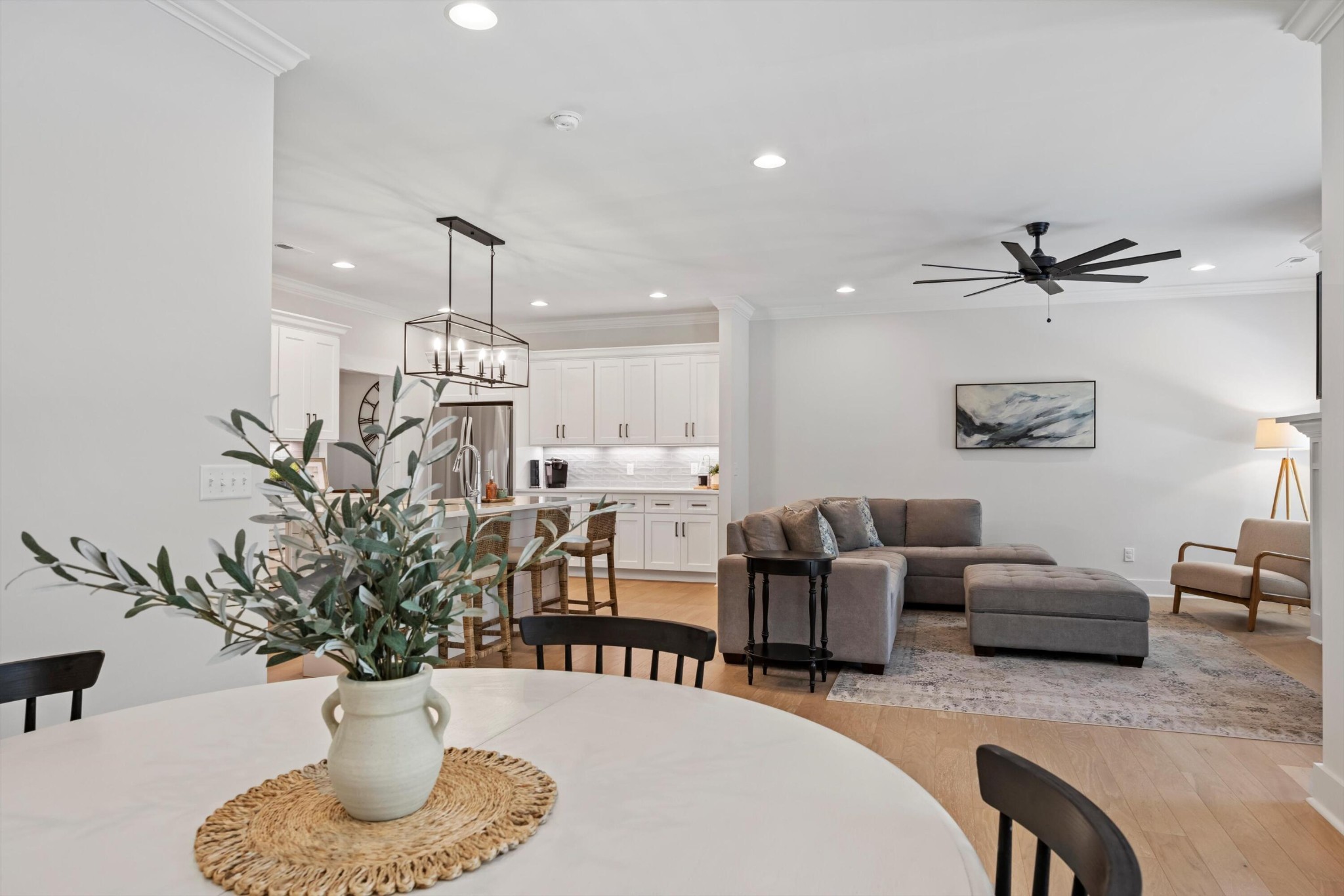 9638 Dutton Lane Ooltewah, TN 37363 - Photo 16 of 38 a living room with furniture potted plant and a chandelier