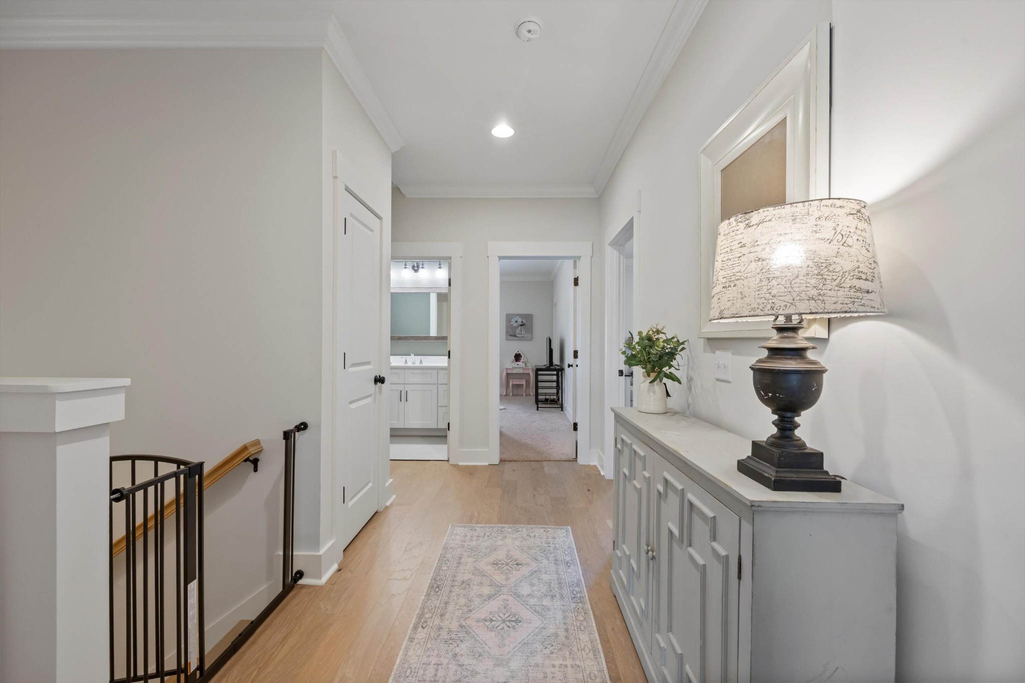 9638 Dutton Lane Ooltewah, TN 37363 - Photo 19 of 38 a hallway with white cabinets and wooden floor